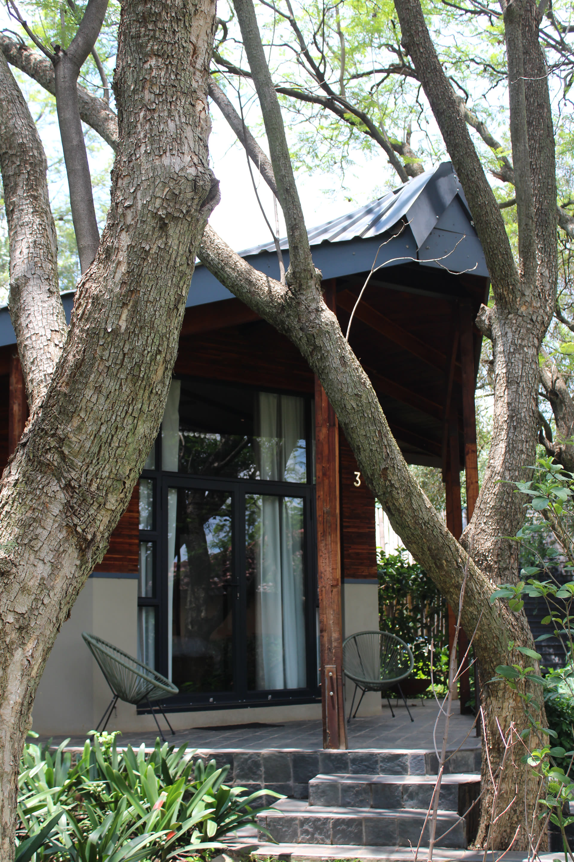 A glamping unit at Qurtuba Resort among mature trees